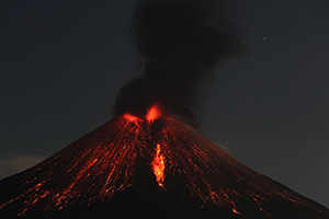 Ash cloud and minor strombolian activity following large nighttime strombolian eruption of Momotombo volcano, Nicaragua