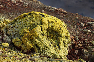 Nyamuragira Volcano rock coated with fumarolic sulfur deposits