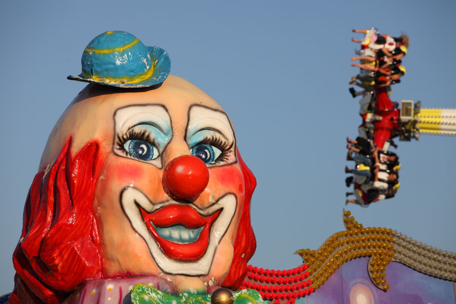 Oktoberfest Munich, 2011, clowns head associated with "Circus" Wellenflug chain carousel
