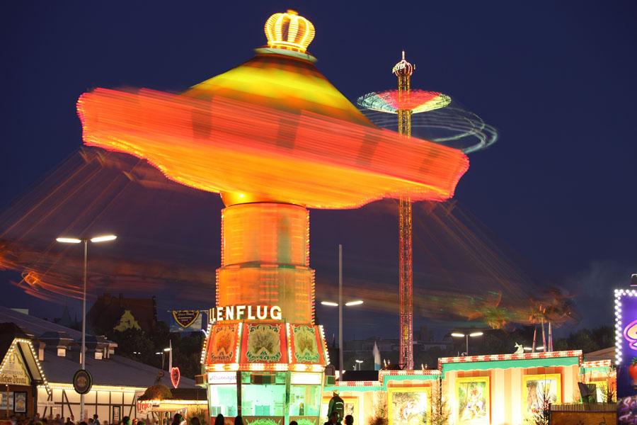 Oktoberfest Munich, 2011, Wellenflug type chain carousel with Starflyer ascending carousel behind