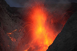 Eruption with dense hail of small volcanic bombs, Batu Tara volcano, Indonesia
