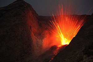 Powerful nighttime explosion blasts volcanic bombs out of vent of Batu Tara volcano