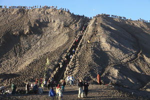Pilgrims and onlookers climbing Mount Bromo during Yadnya Kasada Festival