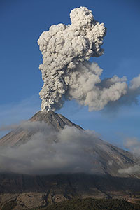 Beautiful ash cloud from Colima volcano which is partially shrouded in cloud