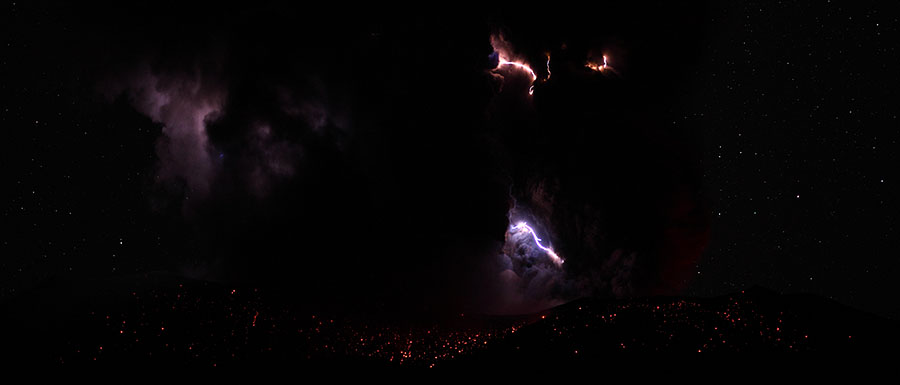 Lightning and glowing volcanic bombs - Dukono volcano after powerful nighttime eruption