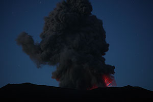 Dukono volcano, ash cloud and strombolian activity at night