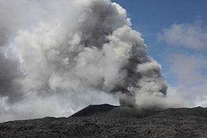 Dukono volcano erupting steam and ash