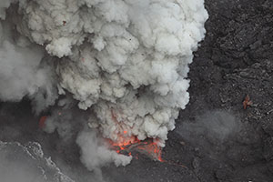 Glowing vent violently erupting gas and lava, Dukono volcano