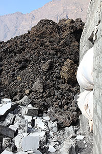Houses destroyed by lava flows, Portela, Fogo Volcano Eruption, 2014, portrait orientation