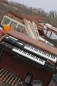 Organ and other household items on hillside above Portela, out of reach of lava
