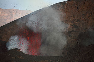 Strombolian Eruption with red glowing lava bombs, Fogo Volcano 2014