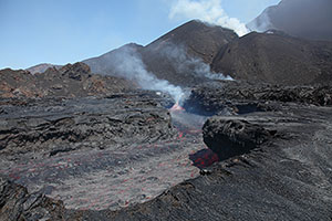 Lava flowing in channel at foot of eruptive complex, Fogo Volcano