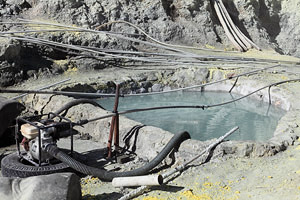 Kawah Ijen volcano, sulfur mine. Pool for collecting water for extinguishing burning sulphur