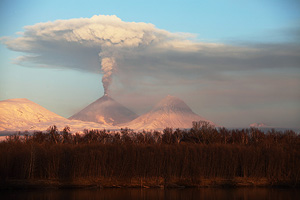 Ash cloud of Kliuchevskoi volcano viewed from Kamchatka River