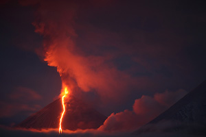 Kliuchevskoi volcano in eruption at night. Strombolian activity with lava flow