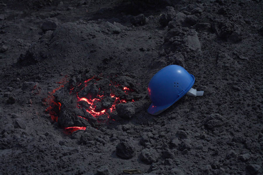 Incandescent Glowing Volcanic Bomb with Helmet.  Anak Krakatau Volcano 2008