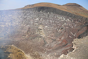 SE wall of Santiago crater, Masaya volcano. Stratified lava flow deposits.