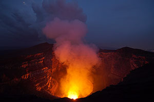 Santiago Crater of Masaya Volcano illuminated by Lava Lake at Night