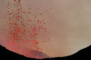Nyamuragira Volcano eruption 2011 / 2012 - glowing lava bombs being ejected from vents in crater