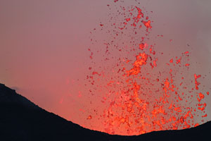 Nyamuragira Volcano eruption 2011 / 2012 - glowing lava bombs hurled above crater during violent spattering / fountaining episode