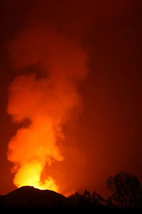 Nyamuragira Volcano degassing cone 2012. Nighttime glow.