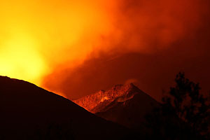Nyamuragira Volcano eruption 2011 / 2012 - open vents illuminate inside wall of crater