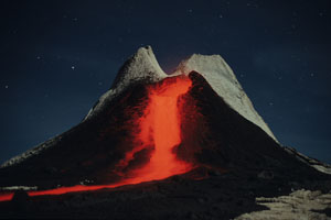 Nighttime carbonatite lava flow on Oldoinyo Lengai volcano, Tanzania
