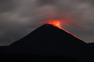 Reventador volcano, Ecuador, Glowing volcanic bombs descend flank