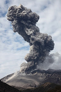 Towering ash cloud bent by different winds at different heights, Sakurajima volcano