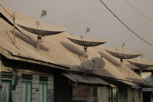 Satellite-dishes coated in ash, Sinabung Volcano