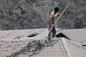 Removing ash from roof, Sinabung volcano