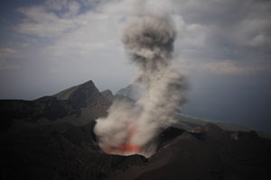 Suwanosejima volcano, ash cloud rising after small vulcanian eruption, night eruption O-take crater, Sakuchi caldera