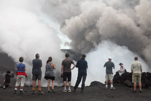 Tourists watching eruptions at Yasur volcano, Vanuatu